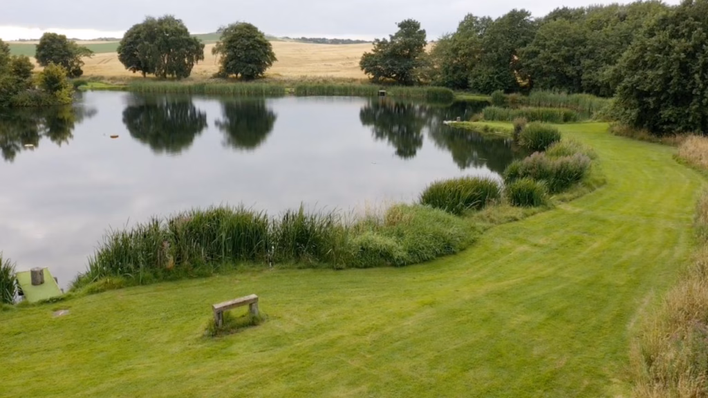 Drone view of Wormit Trout Fishery near Dundee, overlooking the 5-acre loch and grounds